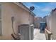 Side yard featuring an air conditioning unit and access to the backyard area at 9680 Granite Gorge Ct, Las Vegas, NV 89148