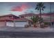 Charming two-story home with well-maintained landscaping and attached two-car garage at 9680 Granite Gorge Ct, Las Vegas, NV 89148