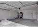 Spacious two-car garage interior with overhead lighting and ample storage at 9680 Granite Gorge Ct, Las Vegas, NV 89148