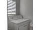 Cozy laundry area showcasing a stacked washer and dryer for space-saving convenience at 9680 Granite Gorge Ct, Las Vegas, NV 89148