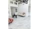 Spacious living room with marble floors, high ceilings, and modern decor at 9680 Granite Gorge Ct, Las Vegas, NV 89148