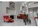Spacious living room featuring a fireplace, tile flooring, and comfortable seating arrangement at 9680 Granite Gorge Ct, Las Vegas, NV 89148