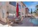 Spacious backyard patio featuring an in-ground pool and outdoor seating at 9680 Granite Gorge Ct, Las Vegas, NV 89148