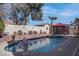 Beautiful in-ground pool and spa with mature landscaping and a gazebo in the backyard at 9680 Granite Gorge Ct, Las Vegas, NV 89148