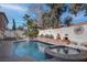 Backyard featuring an in-ground pool and spa at 9680 Granite Gorge Ct, Las Vegas, NV 89148