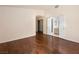 Large bedroom featuring wood floors and views to an ensuite bathroom at 9725 Sierra Mesa Ave, Las Vegas, NV 89117