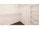 This walk-in closet provides ample storage space with built-in shelves and hanging rods at 9725 Sierra Mesa Ave, Las Vegas, NV 89117