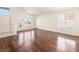 Spacious living room with hardwood floors and many windows at 9725 Sierra Mesa Ave, Las Vegas, NV 89117