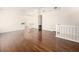 Open living room with hardwood floors leading to the staircase at 9725 Sierra Mesa Ave, Las Vegas, NV 89117