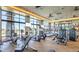 A bright, modern fitness center with ample equipment and large windows offering scenic views at 9858 Gemstone Sunset Ave, Las Vegas, NV 89148