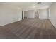 Large bedroom with carpet floors and view into an adjacent room at 9885 Ramhorn Canyon St, Las Vegas, NV 89183