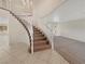 Foyer with a grand staircase leading to the second floor at 9885 Ramhorn Canyon St, Las Vegas, NV 89183