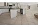 Modern kitchen featuring white cabinetry, stainless steel appliances, and a spacious layout at 9885 Ramhorn Canyon St, Las Vegas, NV 89183