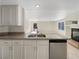 Well-equipped kitchen with granite countertops, stainless steel appliances, and an open view to the living area at 9885 Ramhorn Canyon St, Las Vegas, NV 89183