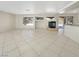 Unstaged living room featuring a fireplace, tile flooring, and sliding glass doors at 9885 Ramhorn Canyon St, Las Vegas, NV 89183