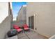 Outdoor patio featuring comfortable lounge chairs and a grill at 9920 Keephills St, Las Vegas, NV 89183