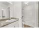 Bright bathroom with granite countertops and a shower-tub combo at 9920 Keephills St, Las Vegas, NV 89183