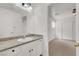 Well-lit bedroom with ensuite bathroom and ceiling fan at 9920 Keephills St, Las Vegas, NV 89183