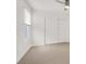 Bedroom with neutral carpet, slider closet and window at 9920 Keephills St, Las Vegas, NV 89183