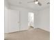 Neutral bedroom with a ceiling fan and ensuite bathroom at 9920 Keephills St, Las Vegas, NV 89183