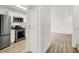Modern kitchen with stainless steel appliances and wood flooring at 9920 Keephills St, Las Vegas, NV 89183
