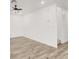 Spacious and open living room featuring laminate floors and neutral decor at 9920 Keephills St, Las Vegas, NV 89183