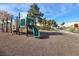 The community playground includes a slide, climbing bars, and seating at 9920 Keephills St, Las Vegas, NV 89183