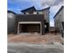 Modern two-story home with attached two-car garage in a suburban neighborhood at 10012 River Corral St, Las Vegas, NV 89166