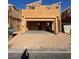 Two-story home under construction featuring an attached two-car garage at 10012 River Corral St, Las Vegas, NV 89166