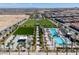Stunning aerial view of the community showcases the pool, green space, and surrounding neighborhood at 10065 Auburn Rose Ave, Las Vegas, NV 89143