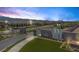Beautiful community entrance with stone signage, landscaping, and well-maintained streetscape at 10065 Auburn Rose Ave, Las Vegas, NV 89143