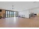 Spacious fitness center with wood paneling, floor-to-ceiling windows, and extensive equipment at 10065 Auburn Rose Ave, Las Vegas, NV 89143