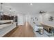 Inviting living space flowing seamlessly into the kitchen with hardwood floors at 10065 Auburn Rose Ave, Las Vegas, NV 89143