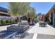 Inviting outdoor lounge features comfortable seating, ambient lighting, and lush landscaping at 10065 Auburn Rose Ave, Las Vegas, NV 89143
