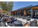 Chic outdoor lounge with comfortable seating, modern umbrellas, and a stylish ambiance at 10065 Auburn Rose Ave, Las Vegas, NV 89143