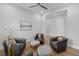 Cozy sitting room featuring comfortable armchairs and soft lighting at 10065 Auburn Rose Ave, Las Vegas, NV 89143