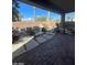 Backyard featuring brick patio, desert landscaping, rock features, and covered patio at 10134 Reflection Brook Ave, Las Vegas, NV 89148
