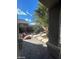 Backyard featuring desert landscaping, rock features, and covered patio at 10134 Reflection Brook Ave, Las Vegas, NV 89148
