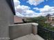 Balcony view shows roofline of nearby home with trees and mountains in the distance at 10134 Reflection Brook Ave, Las Vegas, NV 89148