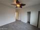 Bedroom featuring wood-look flooring, closet, ceiling fan and natural light at 10134 Reflection Brook Ave, Las Vegas, NV 89148