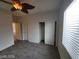 Bedroom featuring wood-look flooring, closet, ceiling fan and natural light at 10134 Reflection Brook Ave, Las Vegas, NV 89148