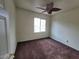 Cozy bedroom with a large window offering natural light and neutral walls ready for personalization at 10134 Reflection Brook Ave, Las Vegas, NV 89148