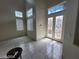 Grand entryway featuring tiled floors, high ceilings, and a decorative glass front door at 10134 Reflection Brook Ave, Las Vegas, NV 89148
