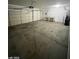 A spacious two car garage with a workbench and plenty of room for storage at 10134 Reflection Brook Ave, Las Vegas, NV 89148