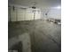 A spacious two car garage with a workbench and plenty of room for storage at 10134 Reflection Brook Ave, Las Vegas, NV 89148
