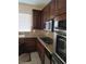 Kitchen featuring granite countertops, stainless steel appliances, and ample storage at 10134 Reflection Brook Ave, Las Vegas, NV 89148
