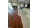 Hardwood floors meet tile in this open concept space with abundant light and dark wood accents at 10134 Reflection Brook Ave, Las Vegas, NV 89148
