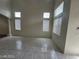 Bright living room featuring tile floors, recessed lighting, and many windows at 10134 Reflection Brook Ave, Las Vegas, NV 89148