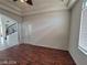 Living room featuring hardwood floors, a decorative wrought iron staircase, and recessed lighting at 10134 Reflection Brook Ave, Las Vegas, NV 89148