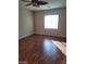 Living room featuring hardwood flooring and natural light at 10134 Reflection Brook Ave, Las Vegas, NV 89148
